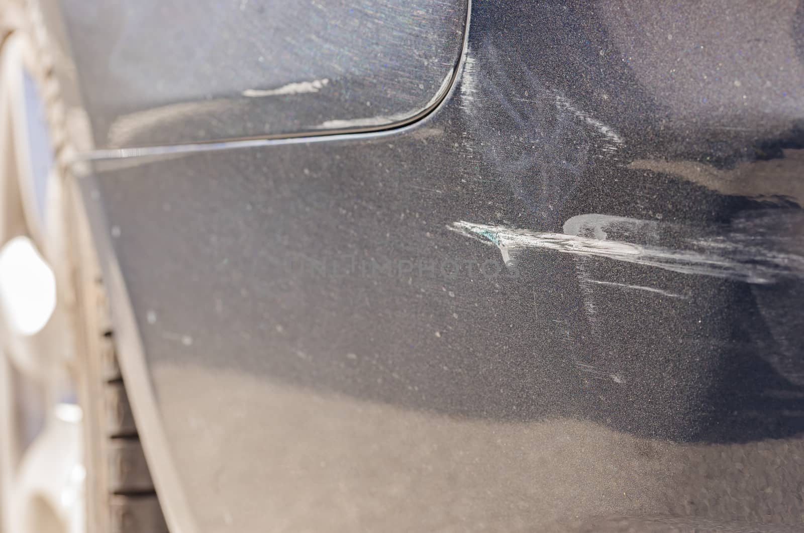 Car accident with close-up of damaged bumper 