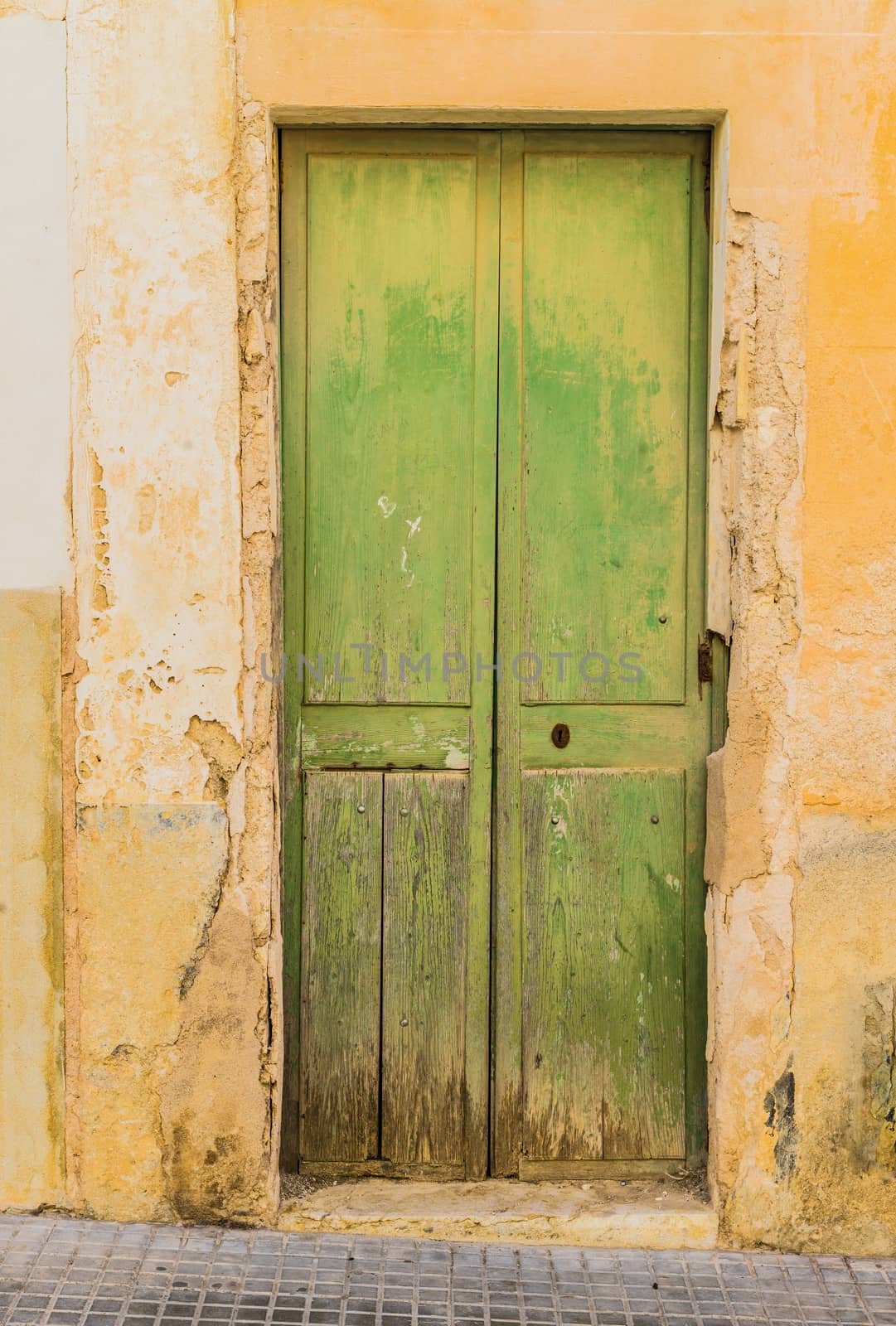 Old green wooden door  by Vulcano