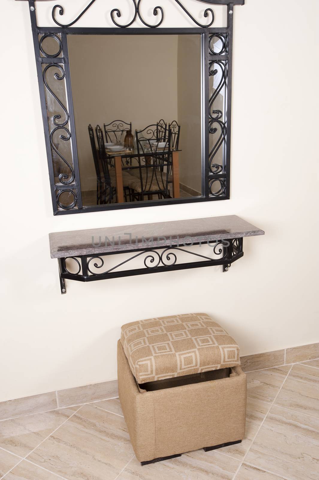 Interior design mirror and shelf on a wall with stool