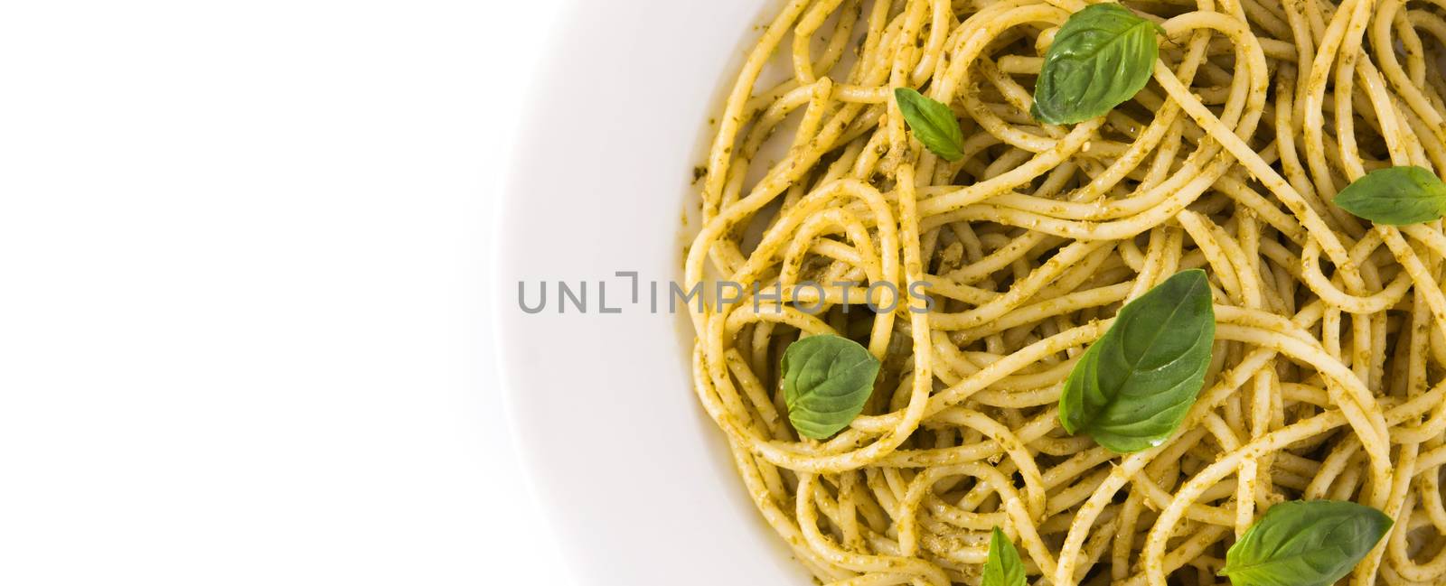 Spaghetti pasta with pesto sauce isolated on white background