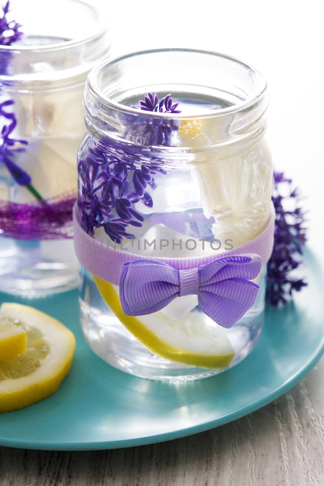 Lavender lemonade drink on white wooden table