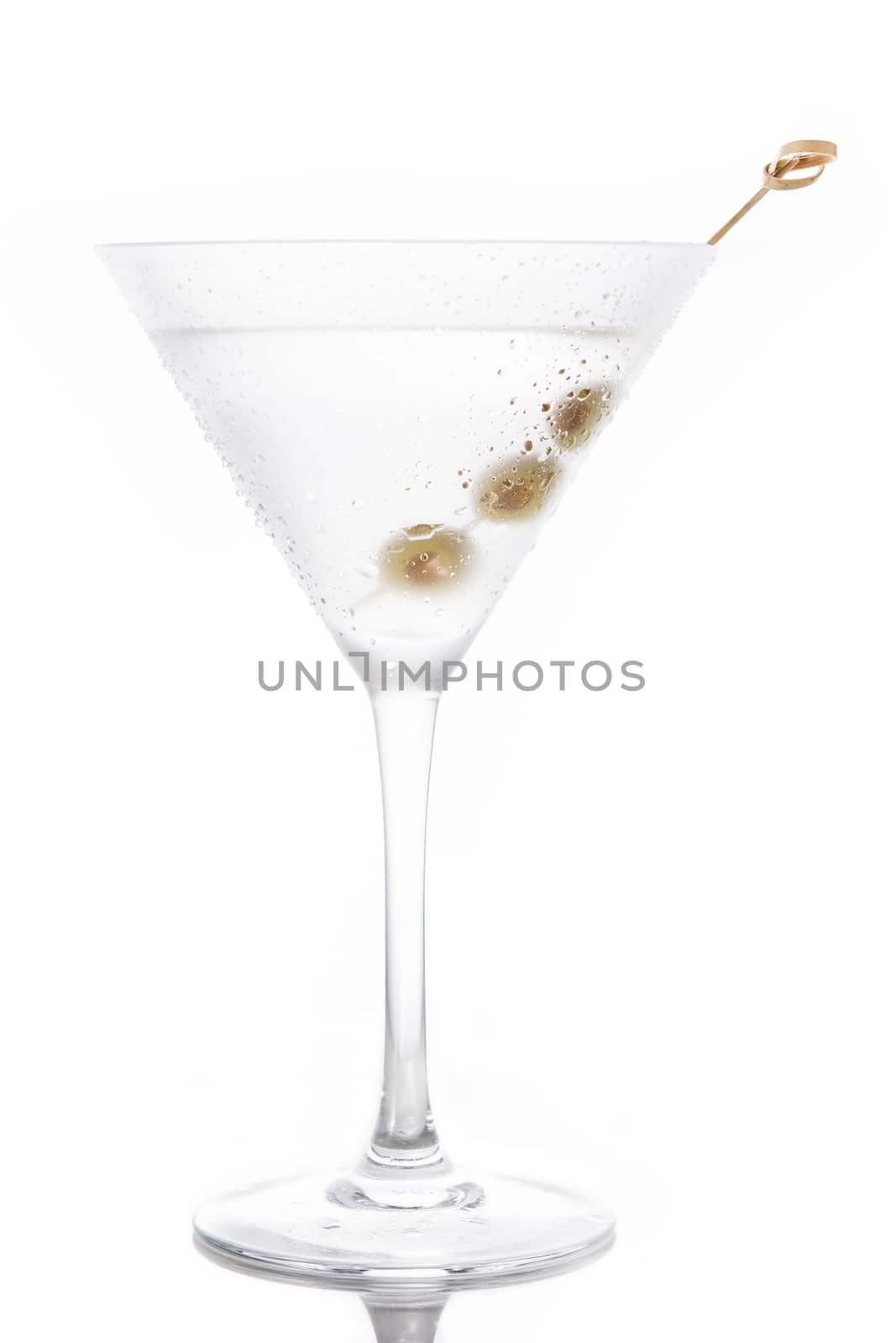 Classic Dry Martini with olives isolated on white background
