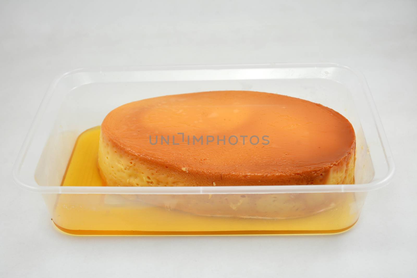 Leche flan Filipino delicacy placed in flat tub  by imwaltersy