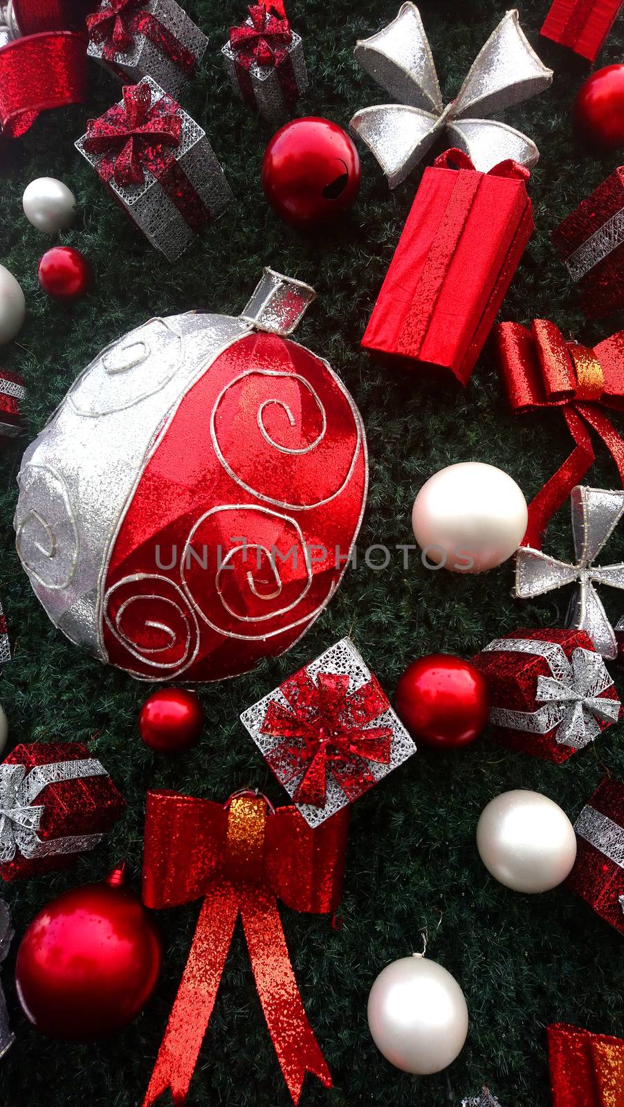 Christmas ball, gift and ribbon decorations attached to Christmas tree
