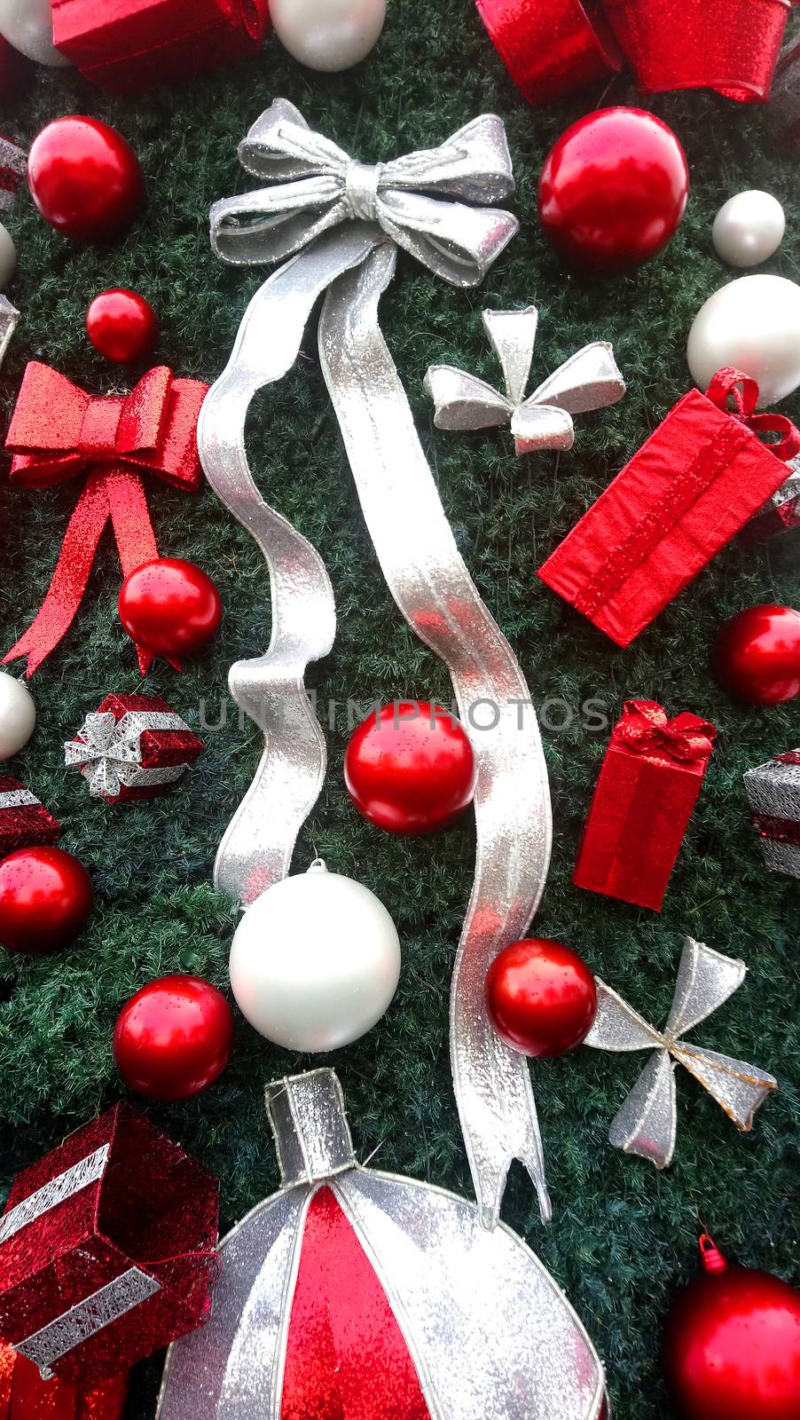 Christmas ball, gift and ribbon decorations attached to Christmas tree