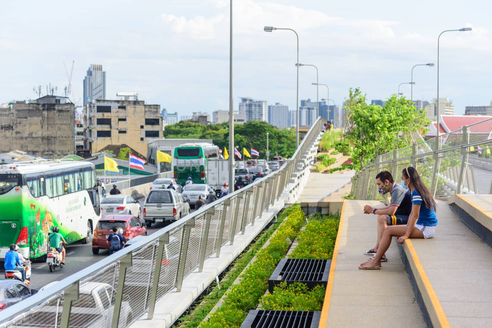 People walking and sitting in relax at Chao Phraya Sky Park  landmark in Bangkok by rukawajung