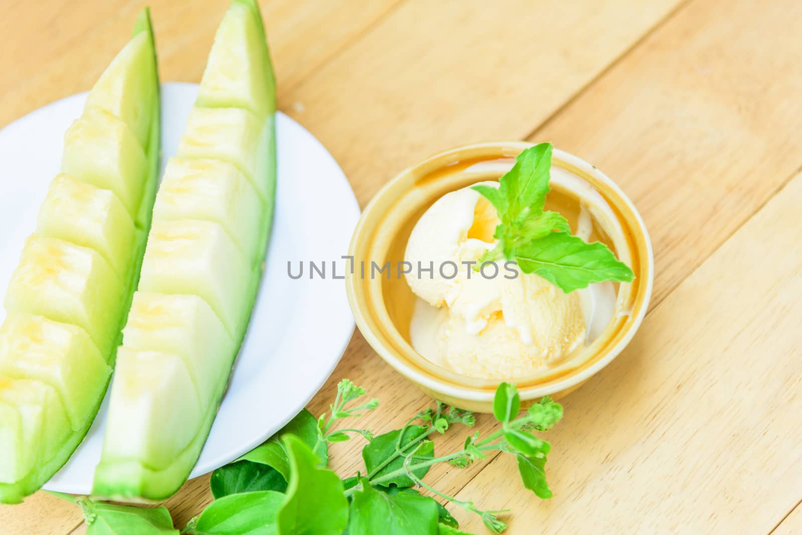 ice cream melon on wood table by rukawajung