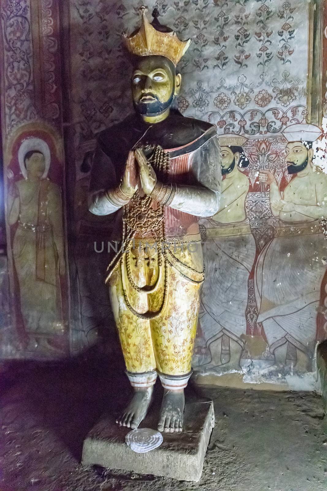 Dambulla, Sri Lanka, Aug 2015: Statue of King Nissanka Malla, Maha Viharaya Alut, standing in the Golden Temple