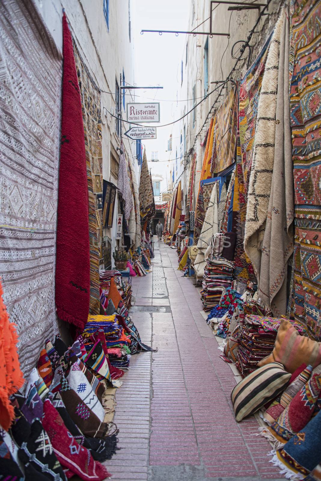 Essaouria, Morocco - September 2017: carpet lined walls of an alley in the medina 
