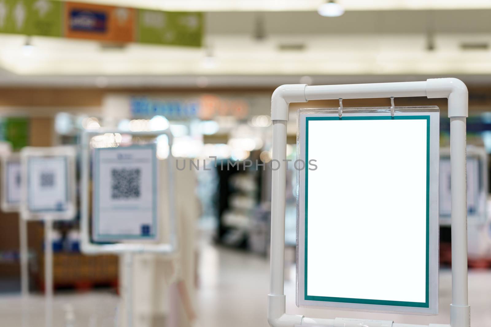 Blank white indoor vinyl banner hanging on white frame for presentation. copy space.