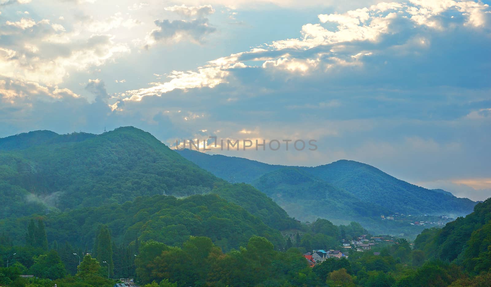 Mountain village after the rain at sunset