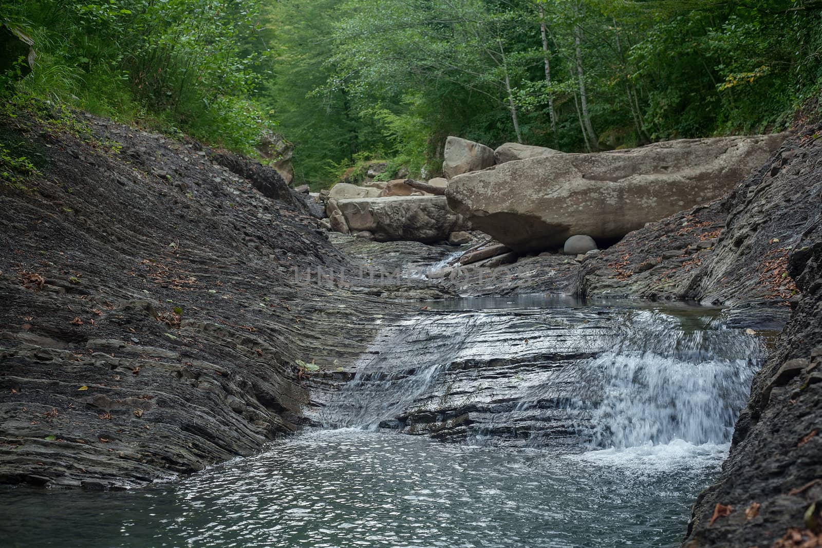 Mountain river in the stone bed by Angorius