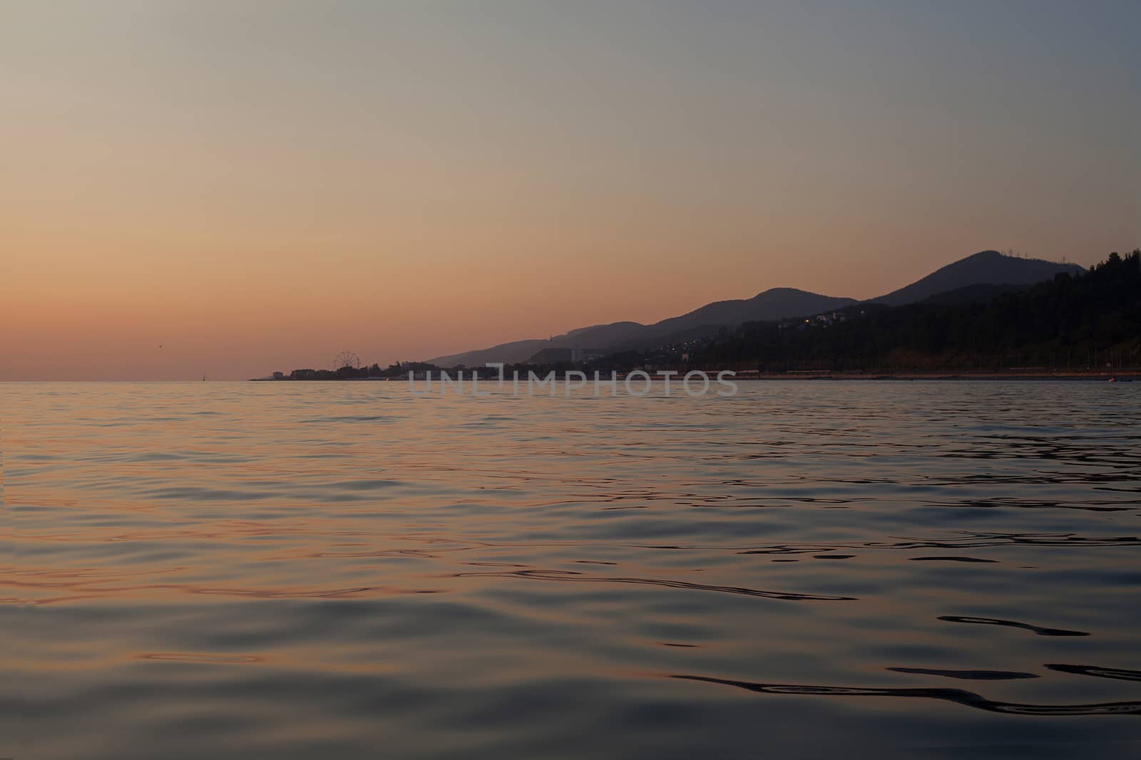 View on the mountains of Caucasus from the Black Sea at sunset