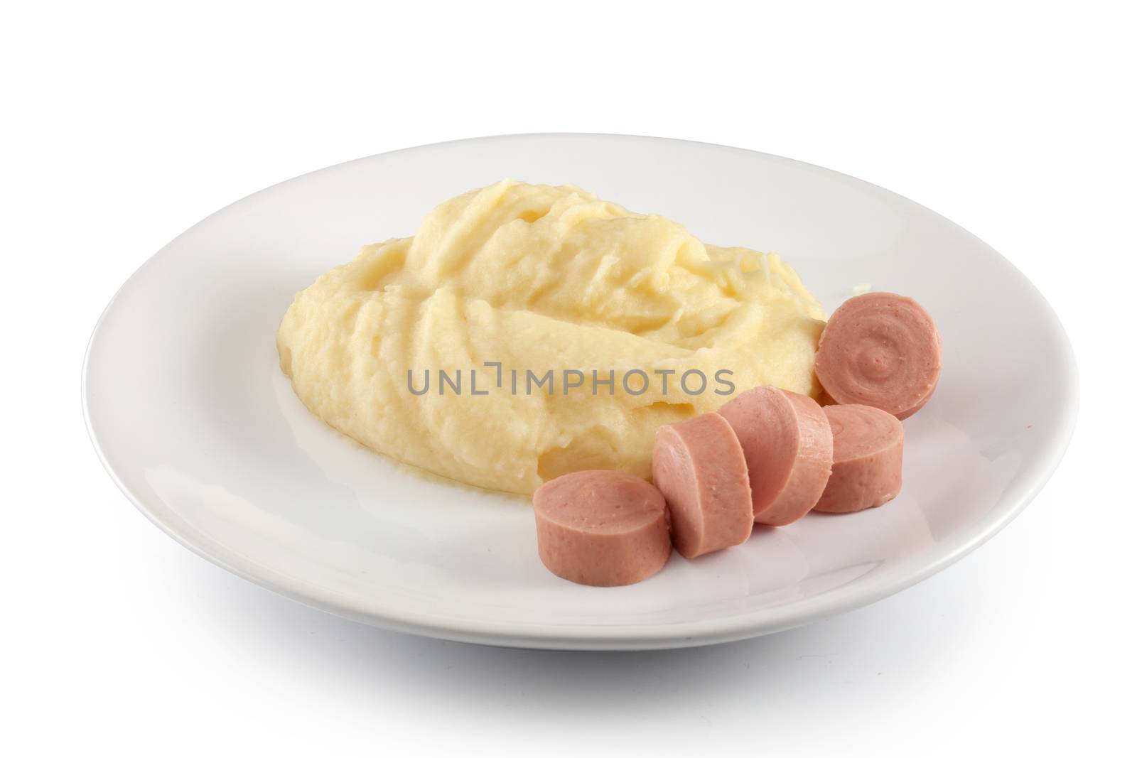 Mashed potatoes with boiled small sausages on the plate