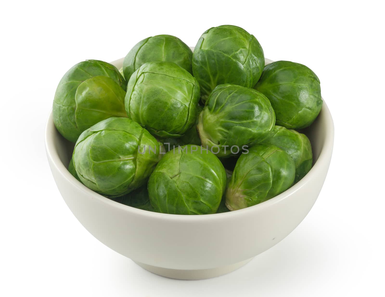 Handful of fresh green brussels sprouts in the bowl