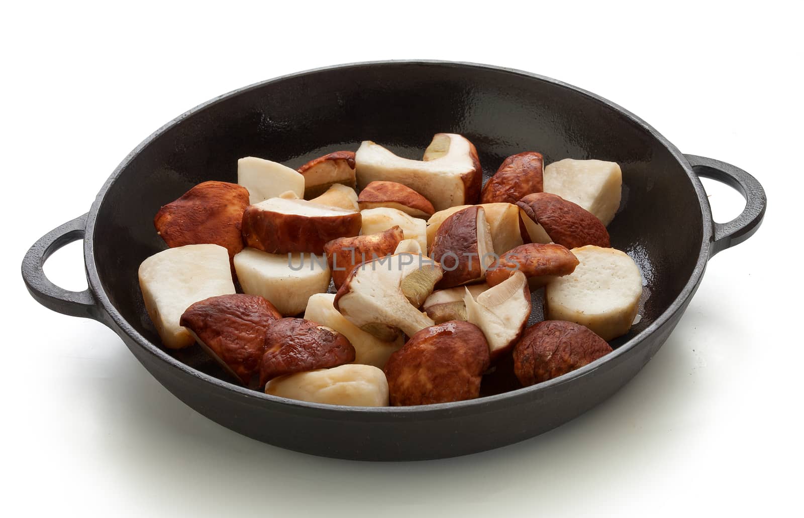 Pieces of white mushrooms in the black iron pan