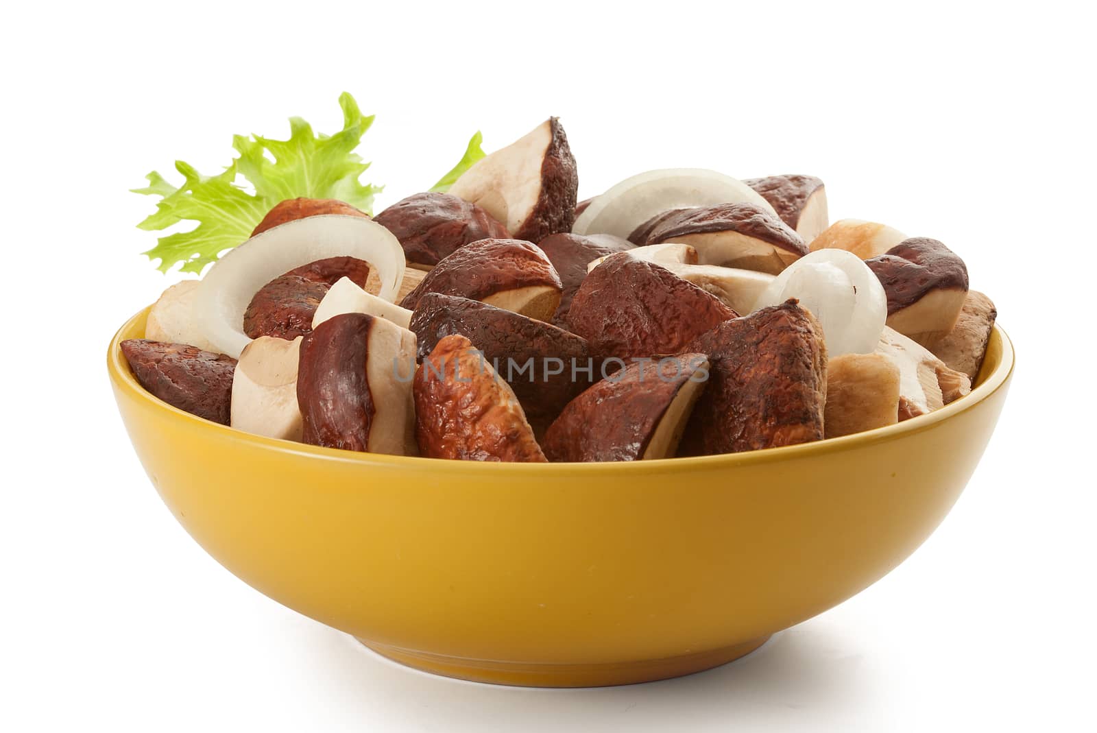 Pieces of white mushrooms and onion rings in the yellow bowl