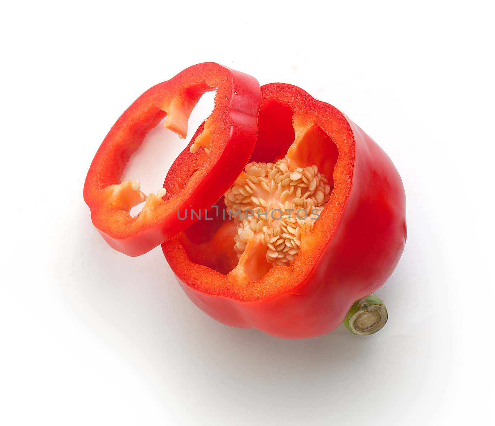 Top view of half red paprika and slice on the white background