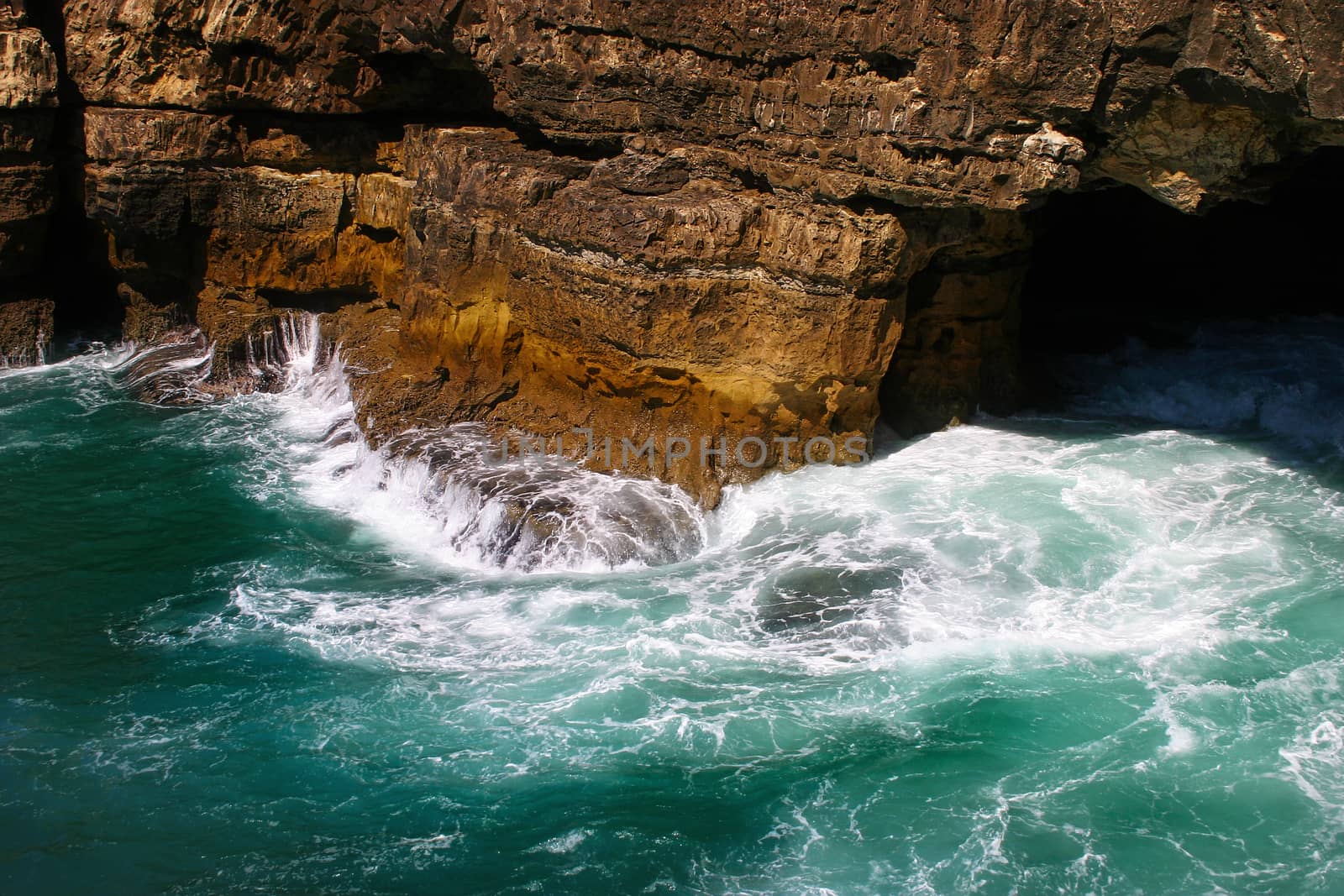 Sea waves hitting rock cliffs at Boca do Inferno, Cascais, Portugal