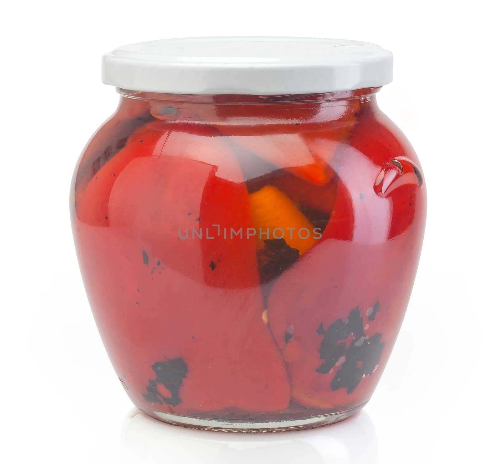 Isolated glass jar with conserved roasted red paprika