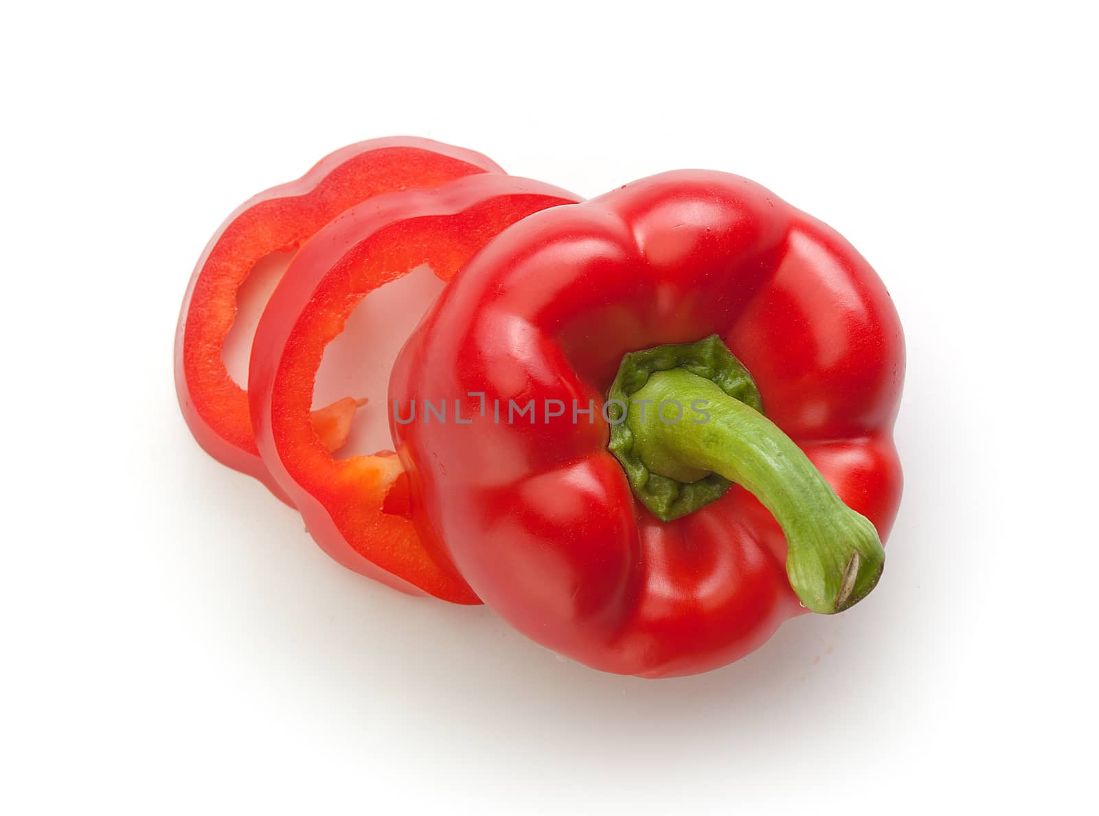 Top view of isolated sliced red paprika on the white background