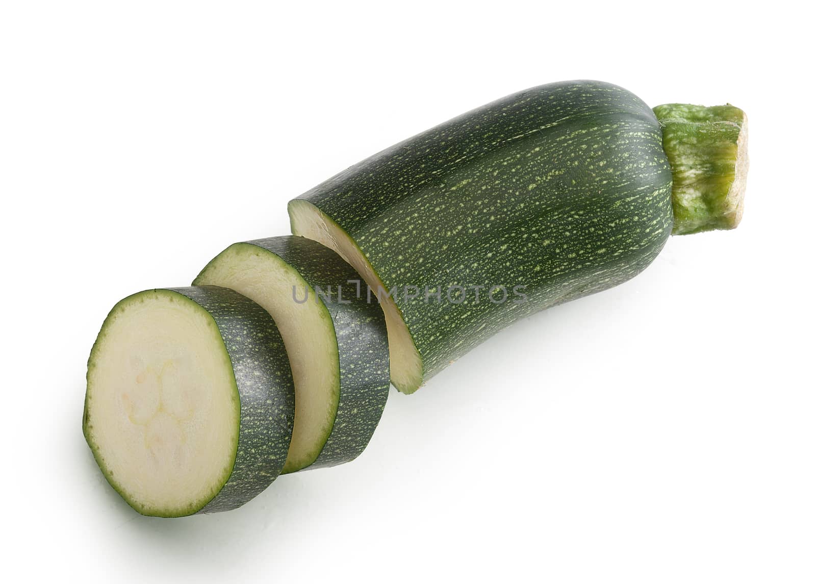 Top view of sliced piece of green zucchini on the white background