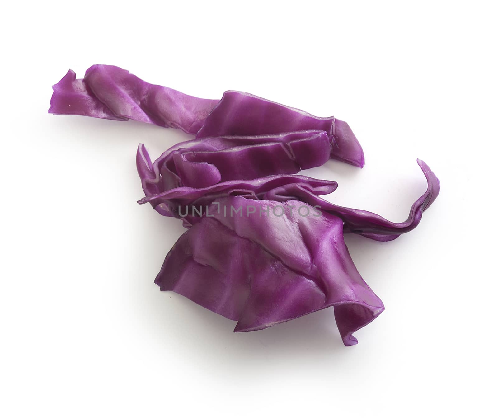 Top view of sliced piece of red cabbage on the white background