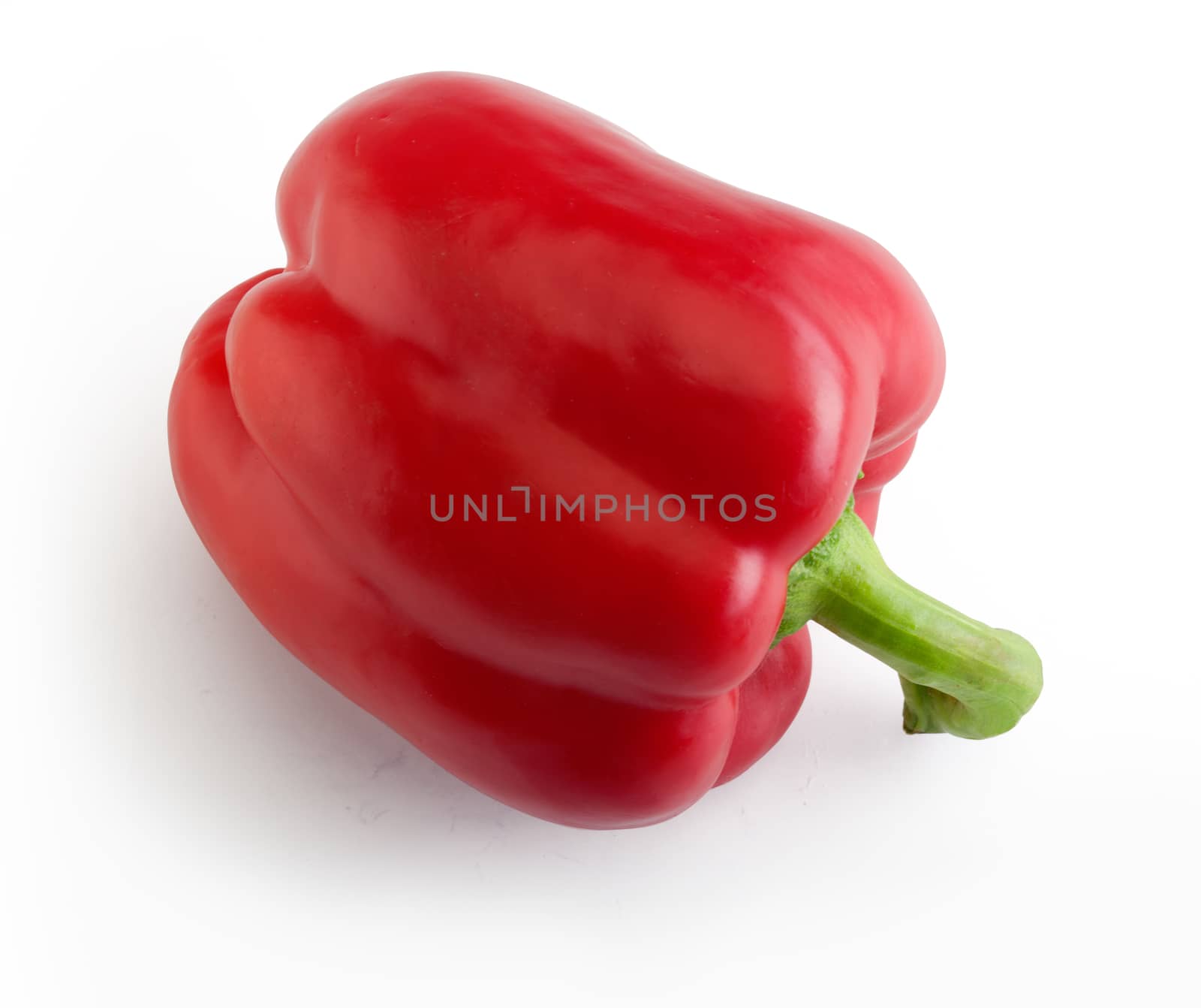 Top view of whole red paprika on the white background