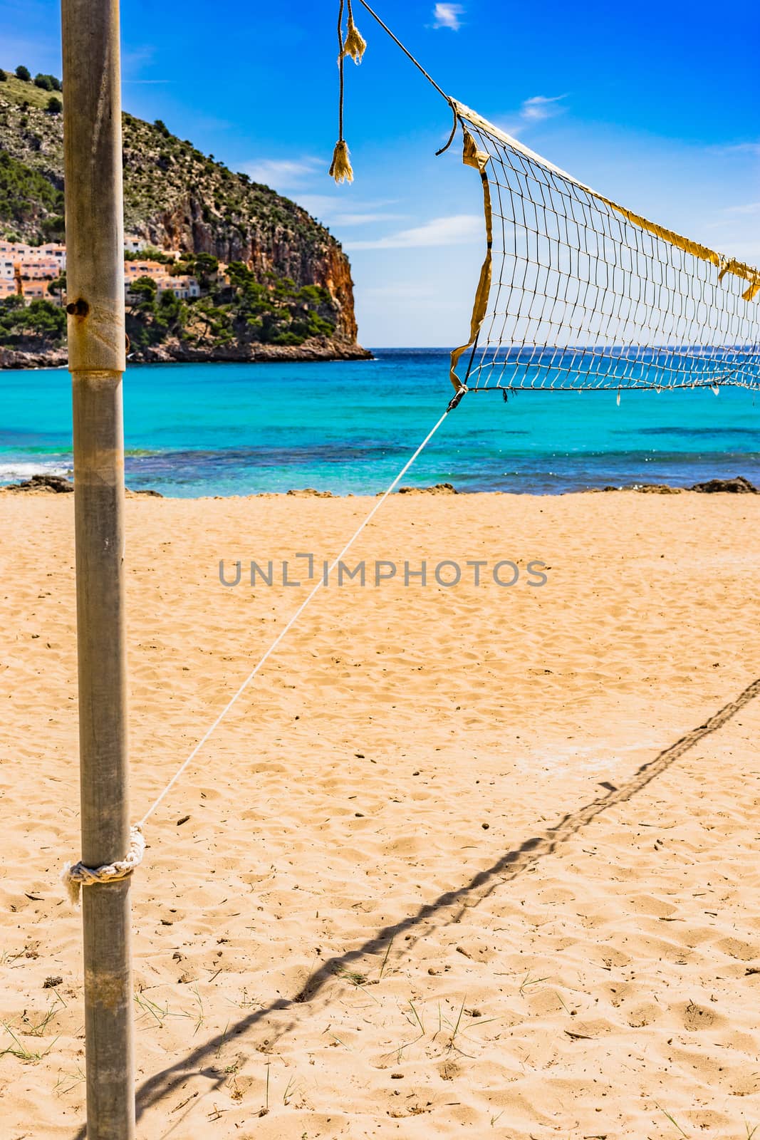 Sand beach volleyball net at beautiful seaside coast