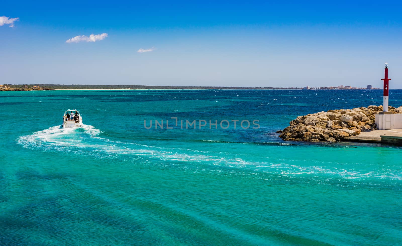 Idyllic view of luxury motorboat yacht driving in turquoise blue sea water