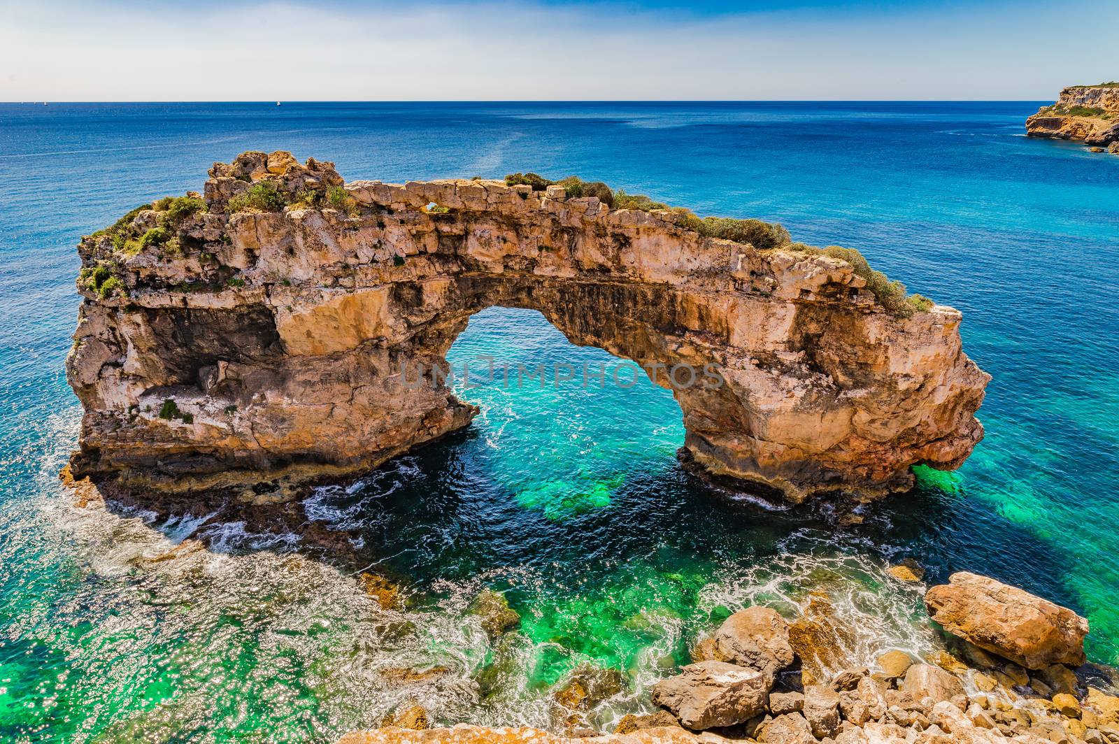Beautiful view of natural arch Es Pontas at the coast on Mallorca island, Spain