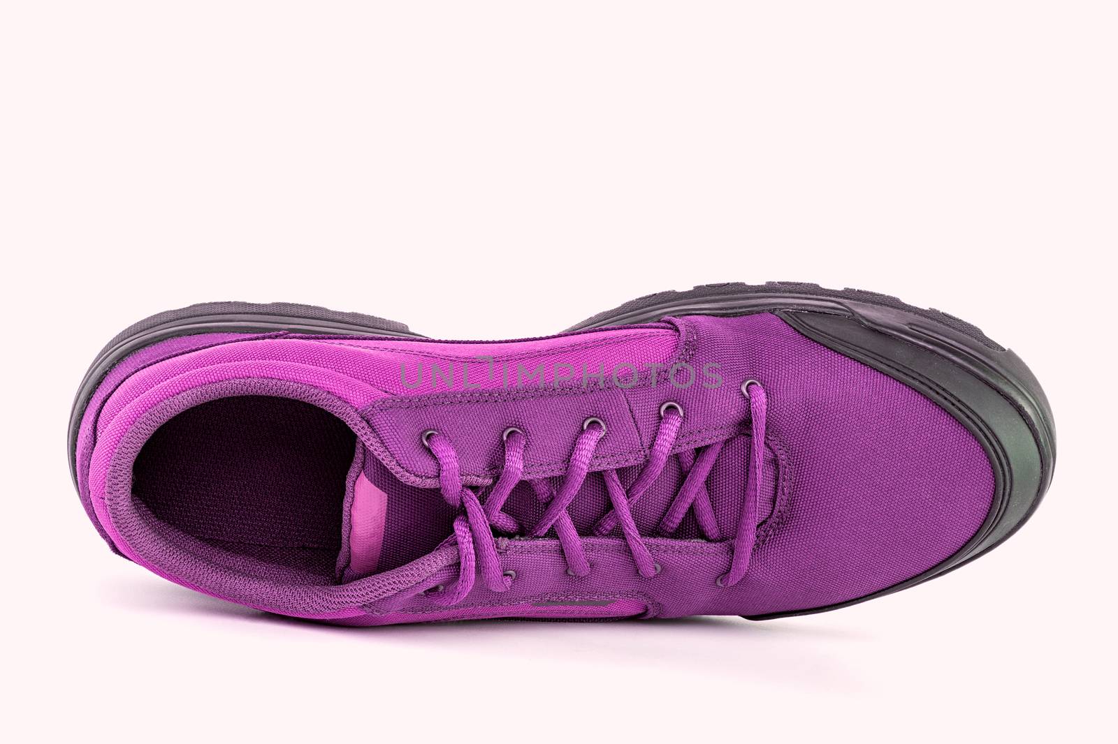 right cheap pink hiking or hunting shoe isolated on white background - view from above by z1b