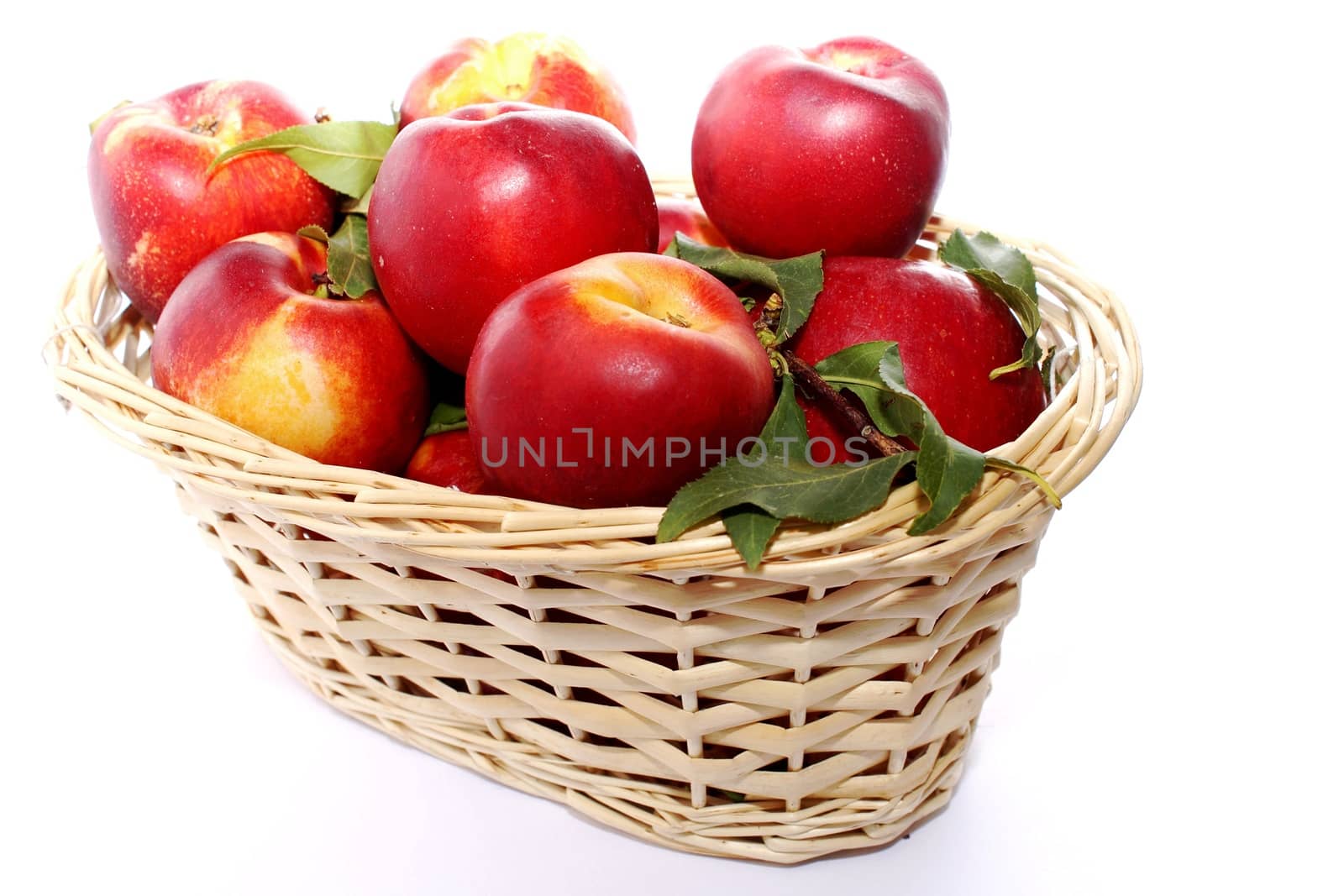 Peaches in wicker basket by Rossella