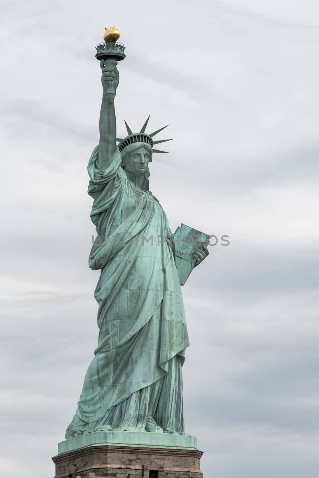 USA, New York - May 2019: Statue of Liberty, Liberty Island against an overcast sky