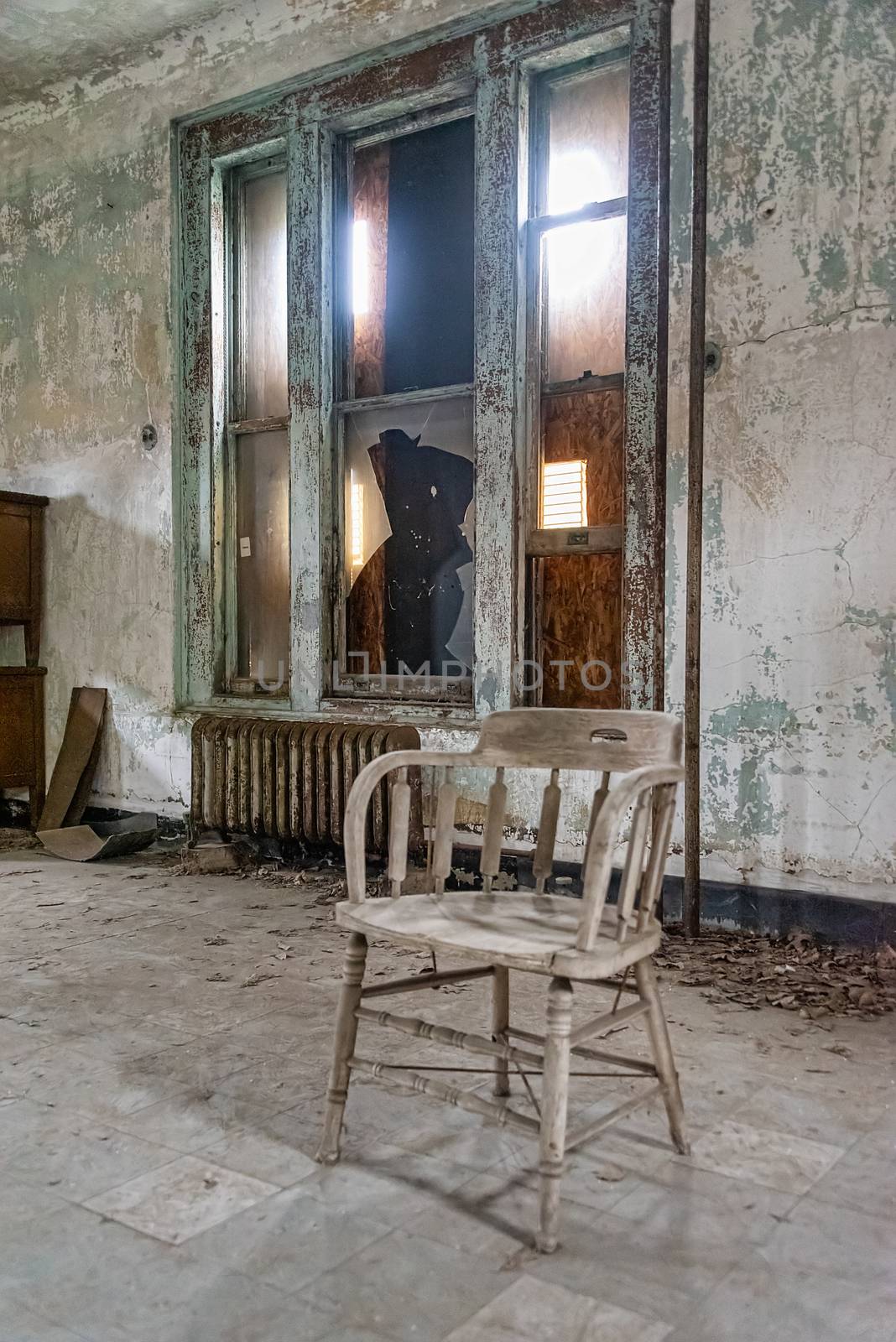 USA, New York, Ellis Island - May 2019: Old furniture abandoned in a derelict building
