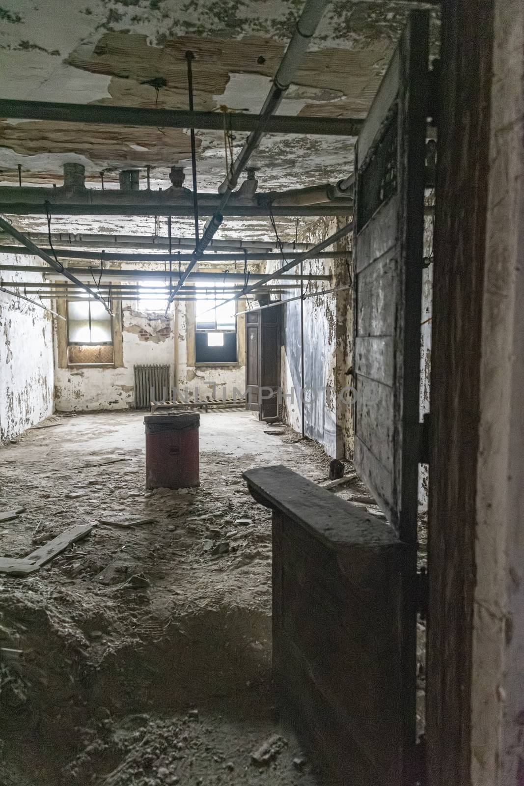 USA, New York, Ellis Island - May 2019: Ruined room with stable door in Ellis Island Hospital
