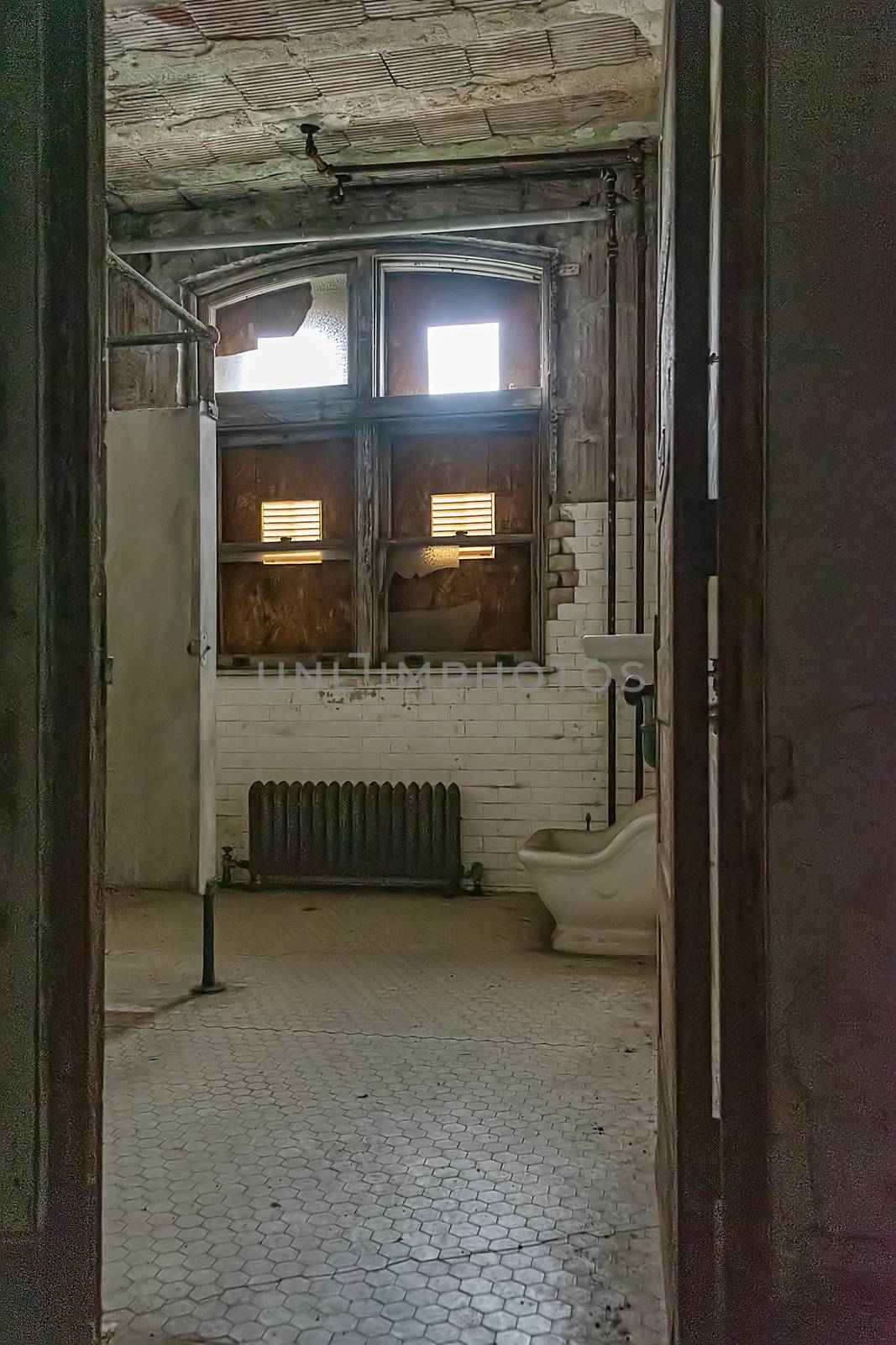 USA, New York, Ellis Island - May 2019: Toilet in abandoned building c. 1930-40
