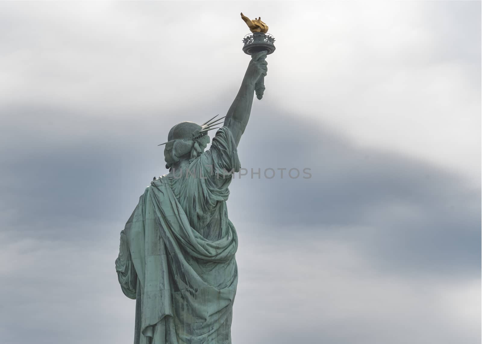 USA, New York - May 2019: Statue of Liberty, Liberty Island against an overcast sky