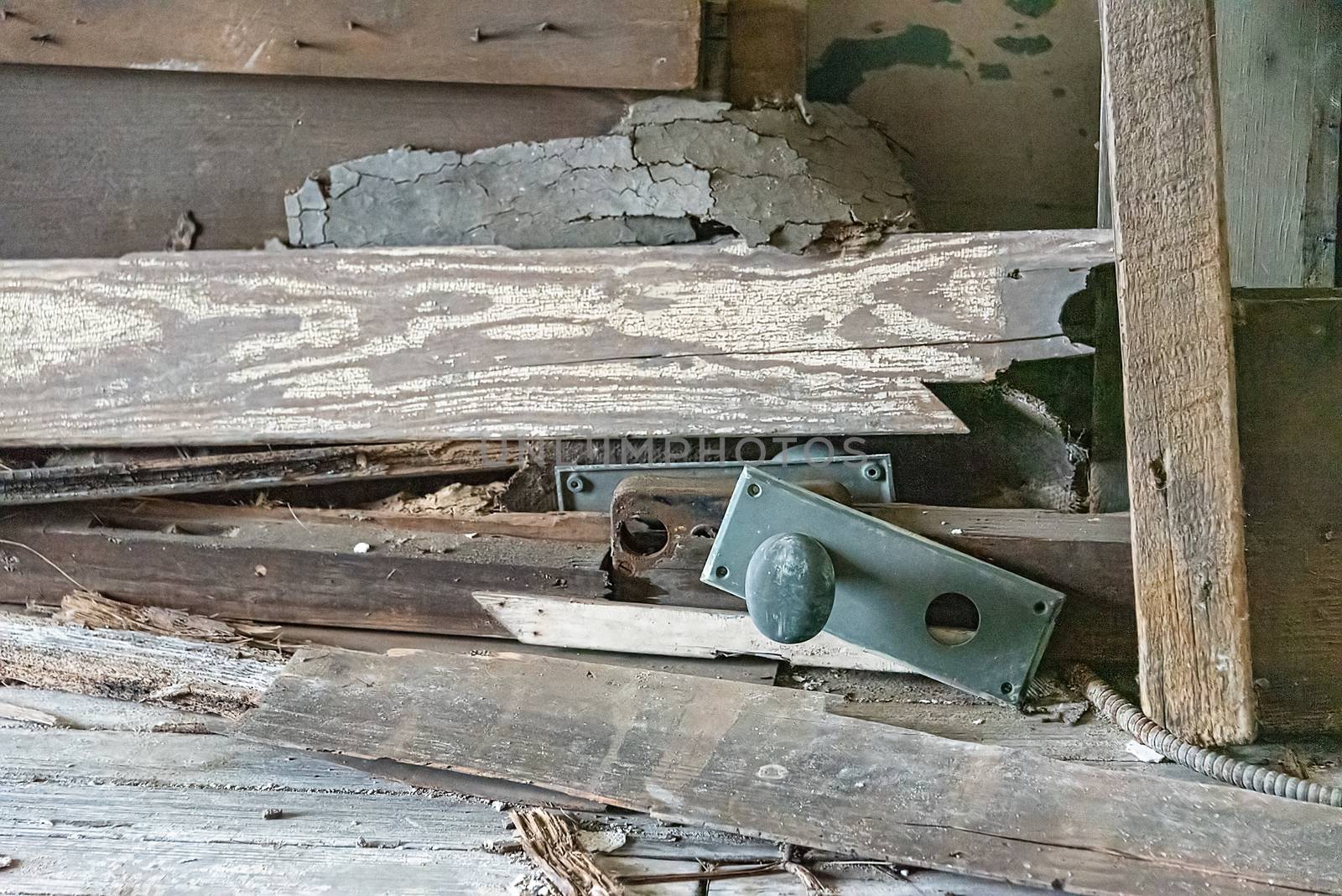 Pile of structural debris including a green corroded door handle by mrs_vision
