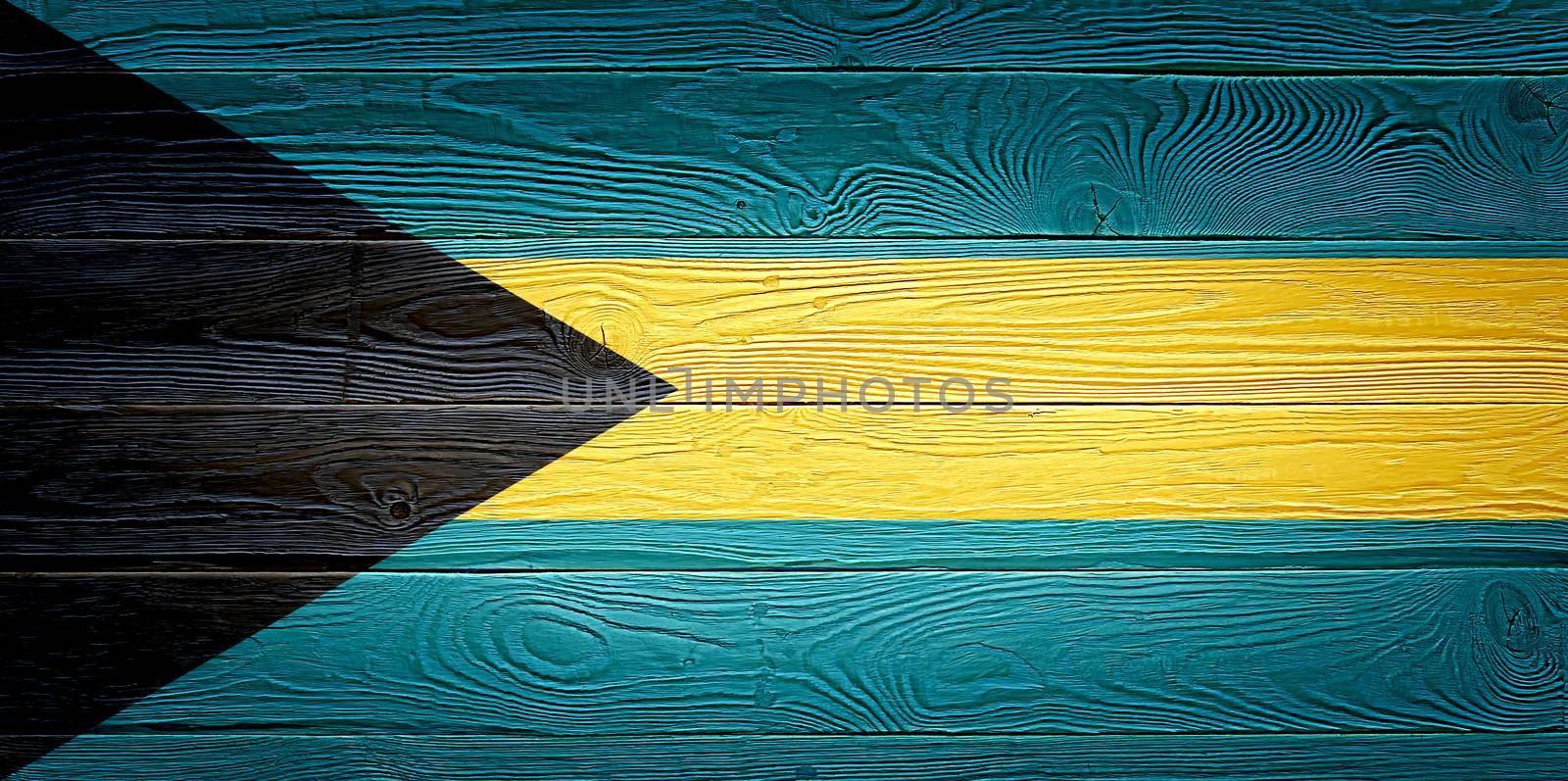 Bahamas flag painted on old wood plank background. Brushed natural light knotted wooden board texture. Wooden texture background flag of Bahamas. by PhotoTime
