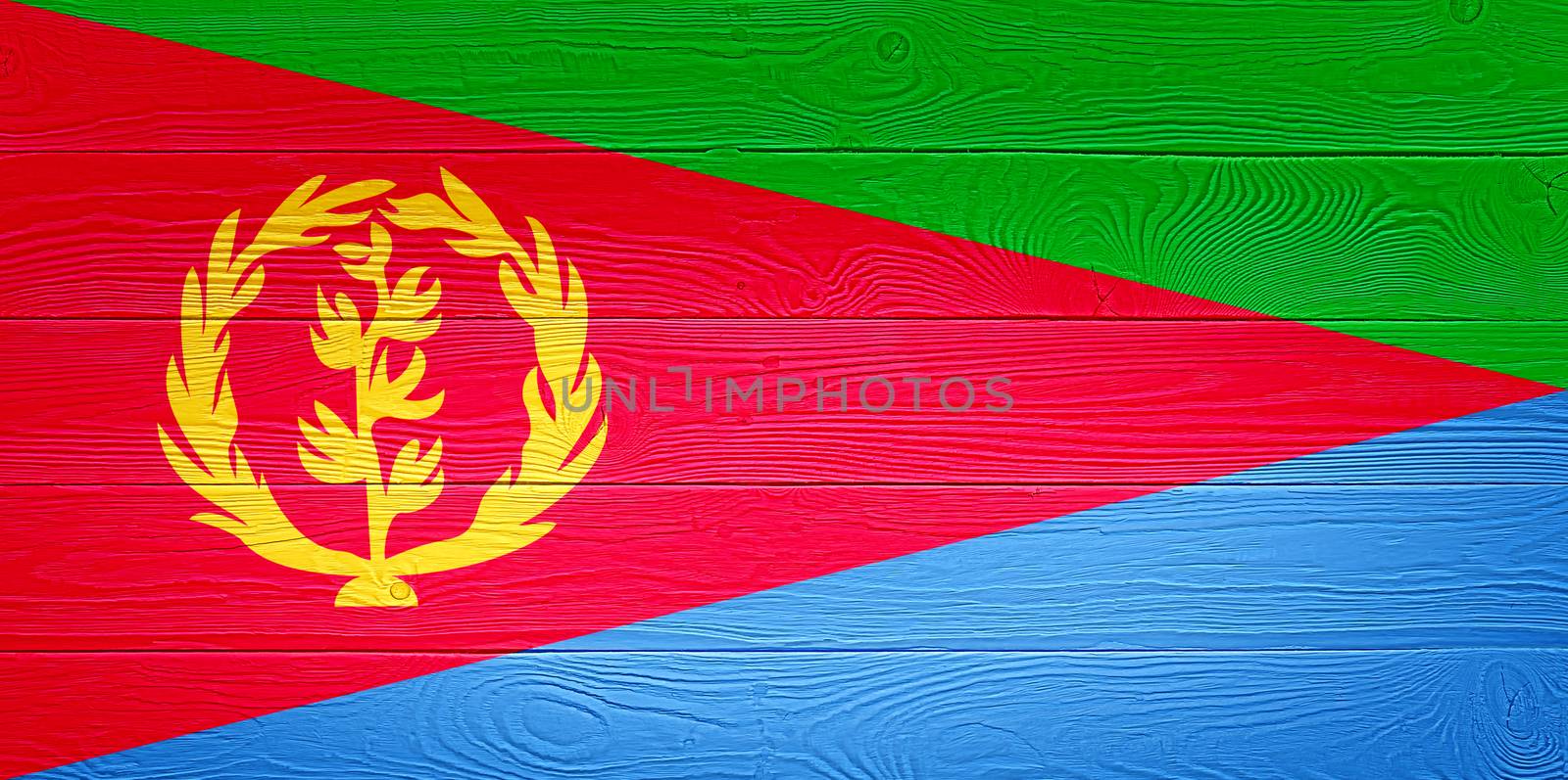 Eritrea flag painted on old wood plank background. Brushed wooden board texture. Wooden texture background flag of Eritrea. by PhotoTime