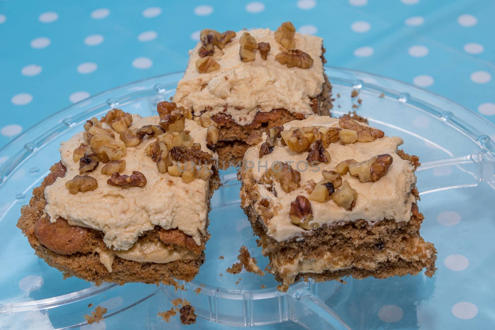 Coffee and Walnut cake slices on a glass plate