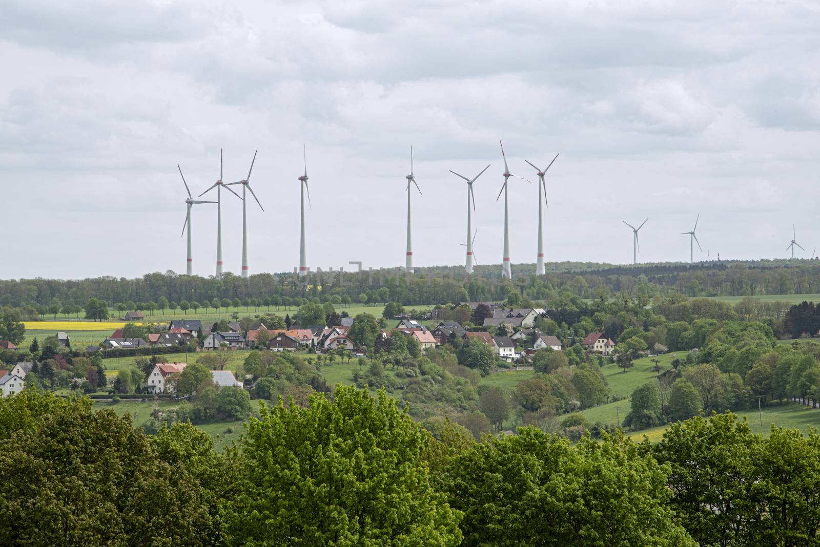 DE, North Rhine-Westphalia - April 2018: Cluster of Wind turbines or power windmills over the Germany country side
