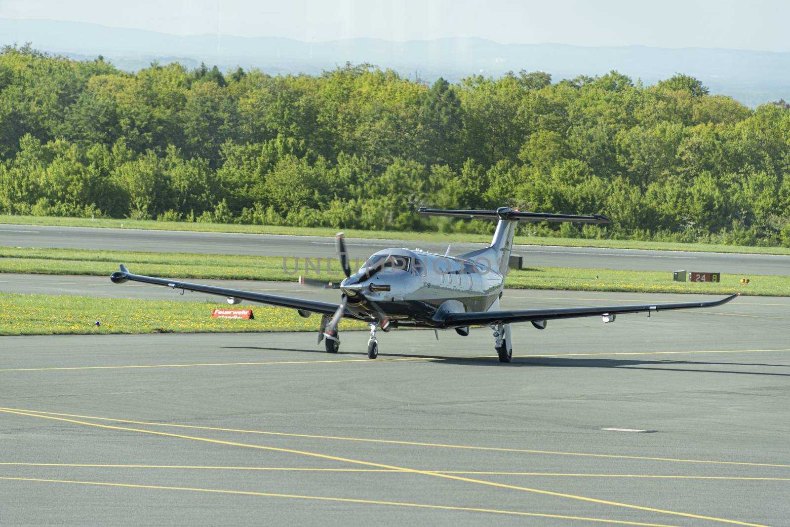 DE, North Rhine-Westphalia - April 2018: Privately owned Twin Propeller PILATUS Eagle, taxis after landing at Paderborn Airfield