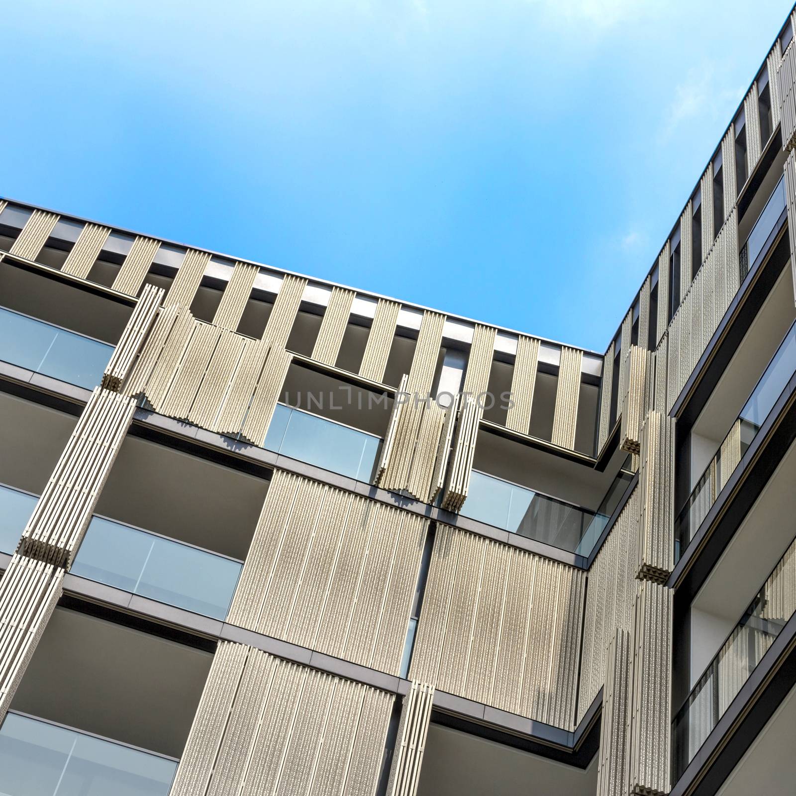 Architectural background of a modern apartments with wooden facade