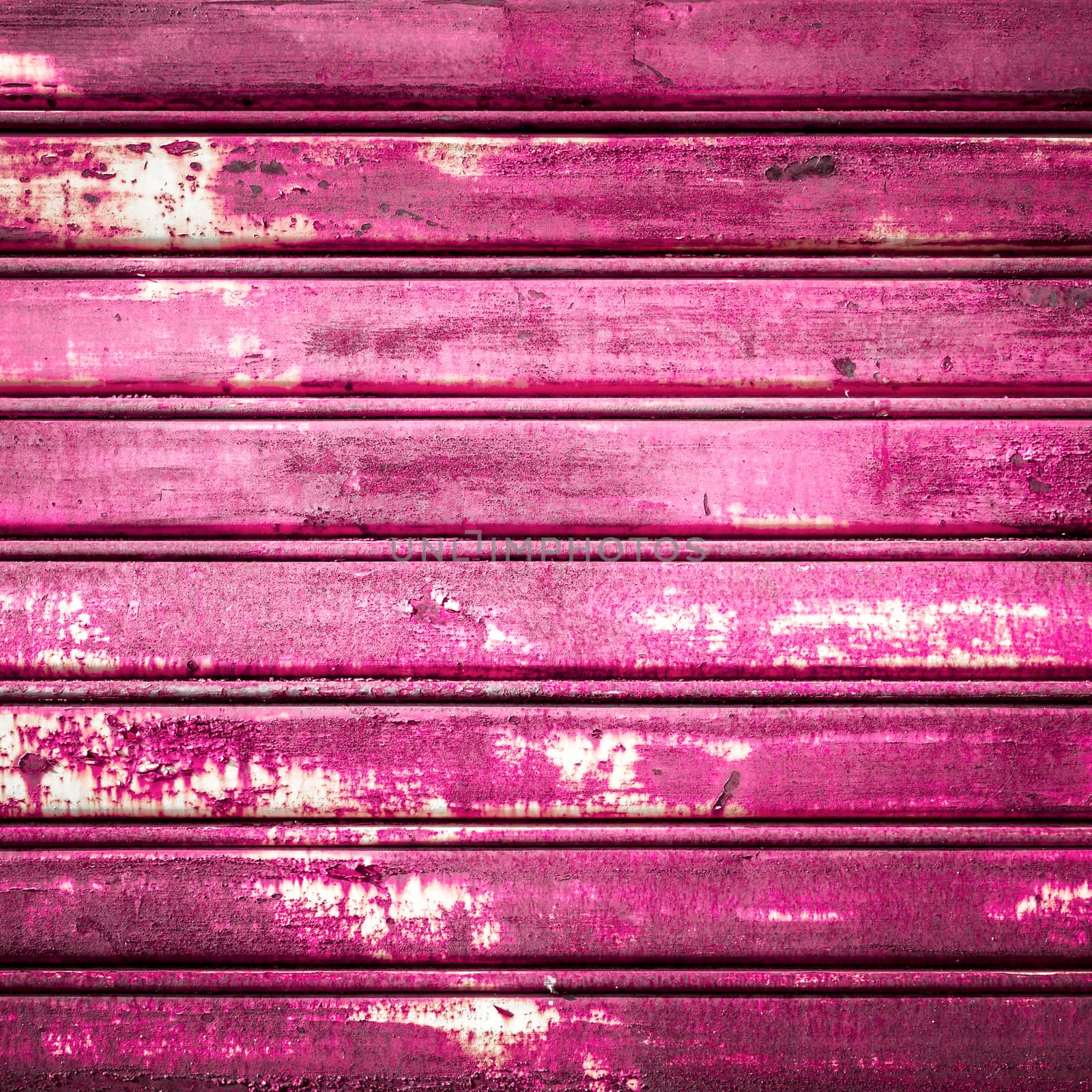 Retro colored background with noise effect; grunge texture with pink/fuchsia color pattern