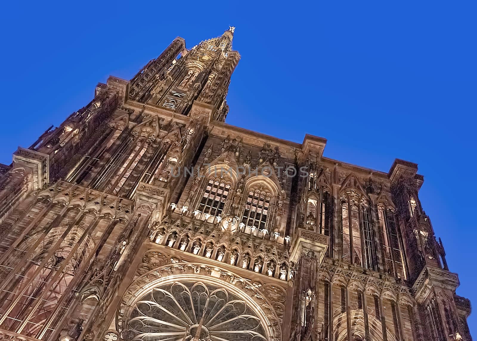 France, Alsace - March 2018: Illuminated facade of the cathedral of Notre Dame in Strasbourg at night