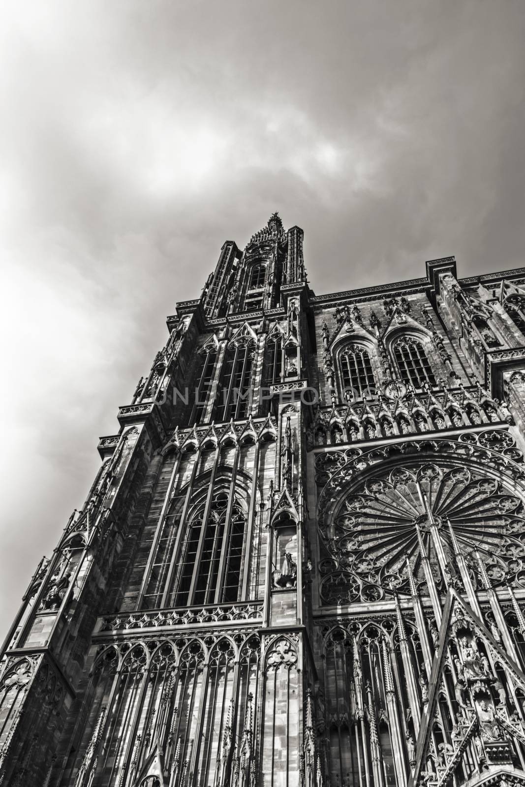 France, Alsace, June 2015: Imposing frontage of Strasbourg Notre Dame Cathedral frontage in Black & white