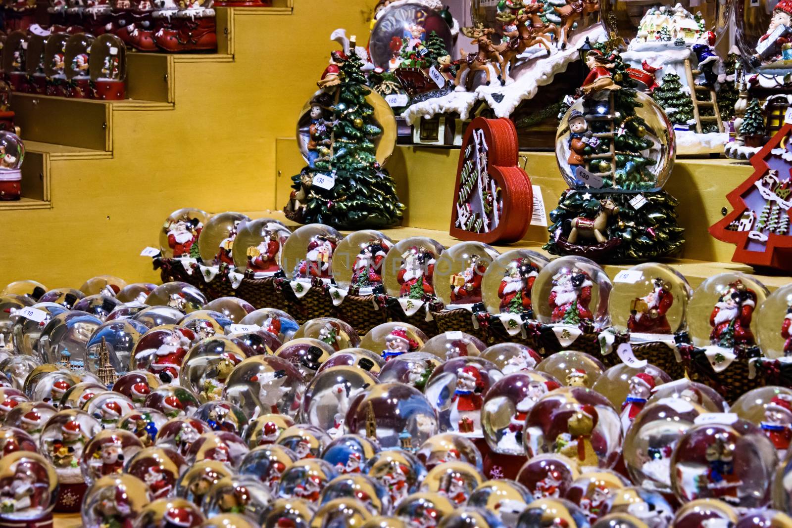 FRANCE, STRASBOURG - 20 DECEMBER 2017: Market stall with many snow globes and christmas ornaments for sale.