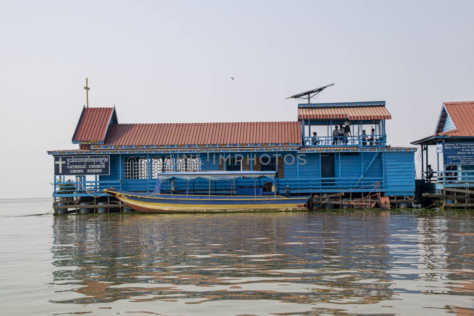 Cambodia, Tonle Sap Floating Village - March 2016: Children playing on the deck of this floating Church which doubles as a school house